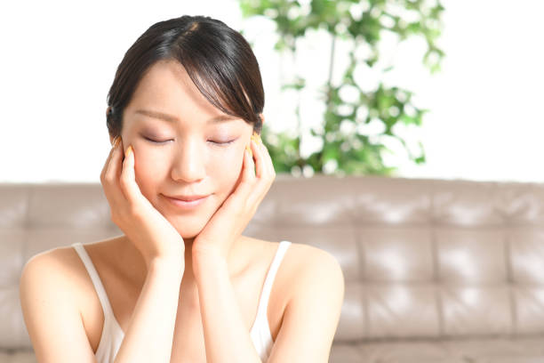 Beauty (skin care) image of a woman wrapping her face with both hands